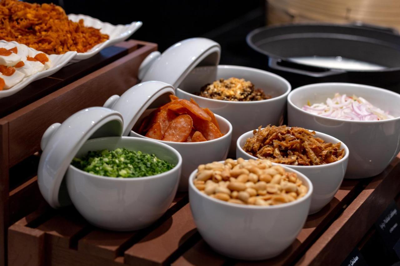 Hotel Grande Centre Point Surawong Bangkok Esterno foto A selection of condiments
